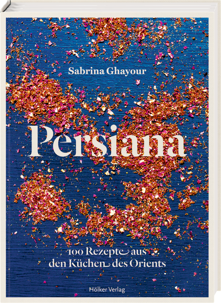 Persiana von Sabrina Ghayour: Das Buchcover zeigt ein rosa und goldenes Glitzerdesign auf blauem Hintergrund.
