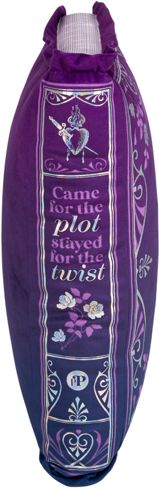 Seitliche Ansicht eines lila Kissen in Form eines Buches mit floralen Mustern und schimmerndem englischem Textdekor.