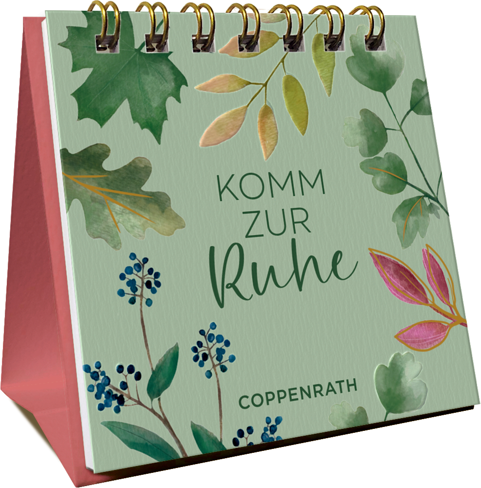 Aufstellkalender mit Spiralbindung, grünem Deckblatt, Blatt- und Beerenmotiven sowie dem Text „Komm zur Ruhe“.
