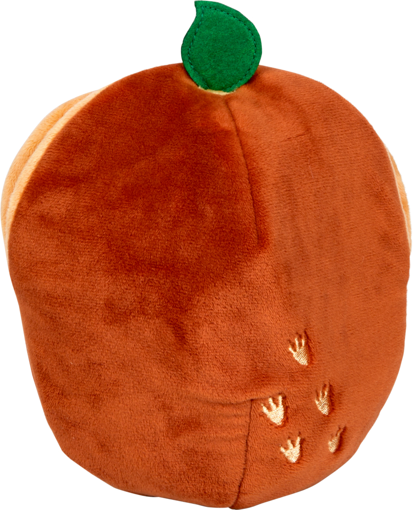 Rundes, orangefarbenes Plüschei mit grüner Stoffblattspitze und kleinen gelben Stickereien in Form von Fußspuren.