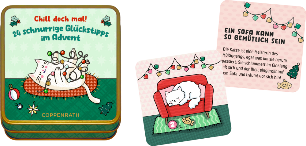 Metallbox mit Illustration einer weißen Katze und Lichterkette, daneben Karten mit schlafender Katze auf rotem Sofa.