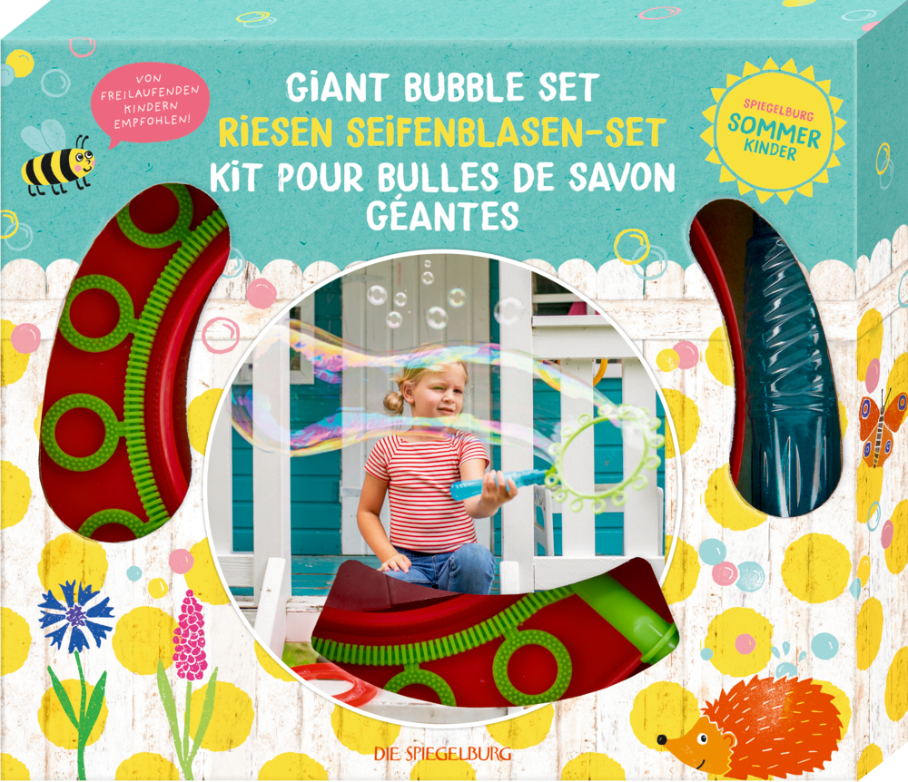Box mit bunten Illustrationen und Foto eines Kindes, das große Seifenblasen macht. Plastikobjekte in Ausschnitten sichtbar.