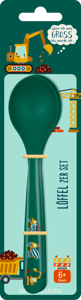 Grüner Babylöffel mit Baufahrzeugmotiven auf einer thematisch gestalteten Kartonrückseite.